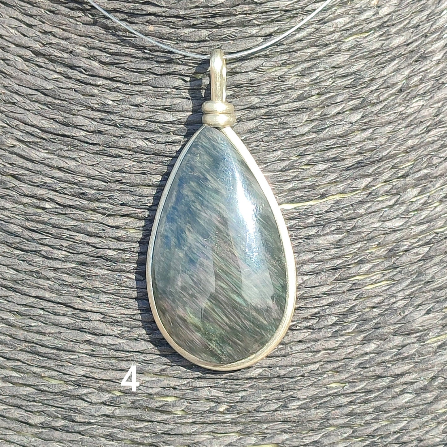 Huichol mantle teardrop obsidian pendant
