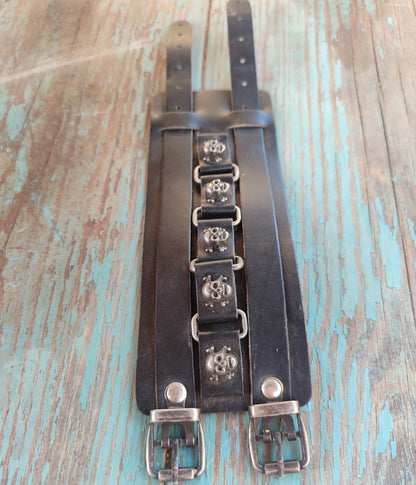 black leather bracelet with skulls