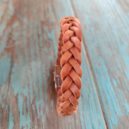 braided leather bracelet with four strands and stainless steel clasp