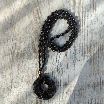 Carved black obsidian necklace