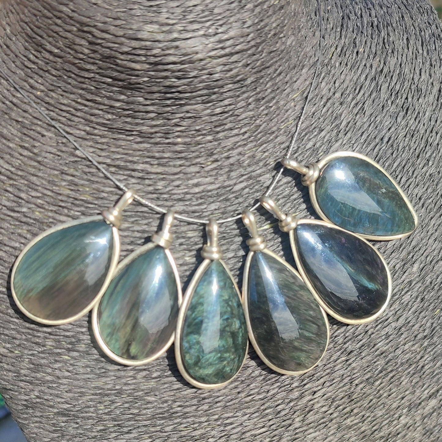 Huichol mantle teardrop obsidian pendant