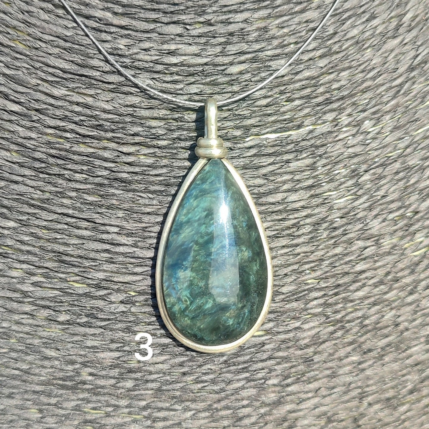 Huichol mantle teardrop obsidian pendant